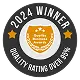 A circular badge with the text 2024 Winner at the top and Quality Rating Over 95% at the bottom, featuring a gold shield in the center that says Quality Business Awards, highlighting top Roofing Melbourne providers with two gold stars on the sides.