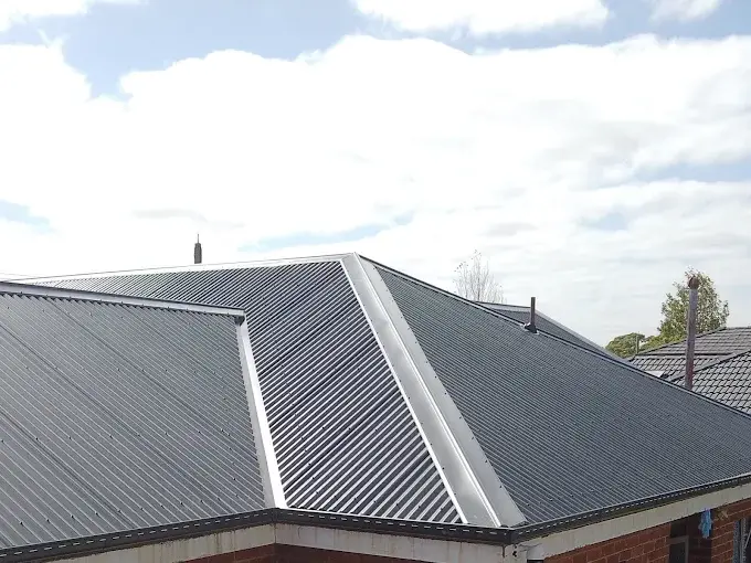 Repaired metal roof on a Melbourne home with clean panel alignment.