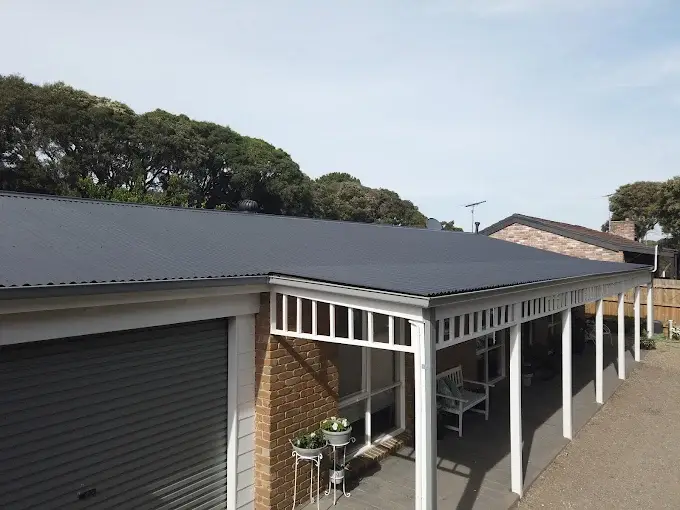Newly repaired metal roof on a residential Melbourne property with a veranda.
