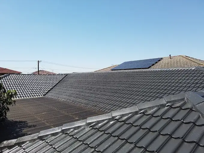 Restored tiled roof with solar panels on a Melbourne home.