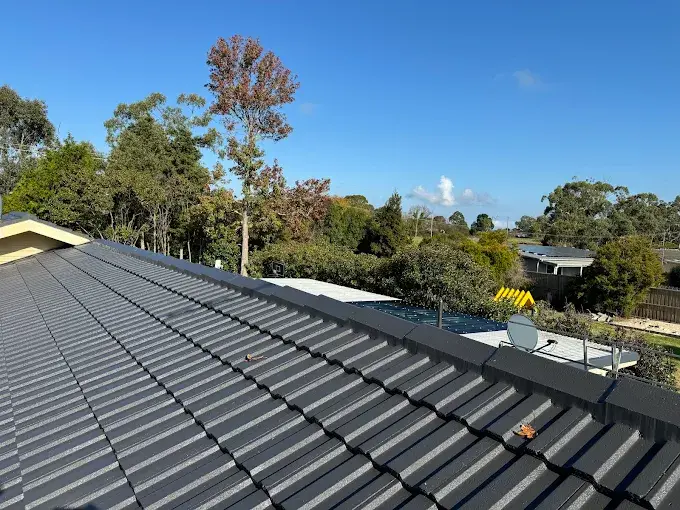 Restored tile roof in Melton with freshly coated tiles and clean finish.