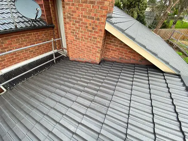 Restored tile roof on a two-storey home in Lilydale with clean finish and upgraded flashing.