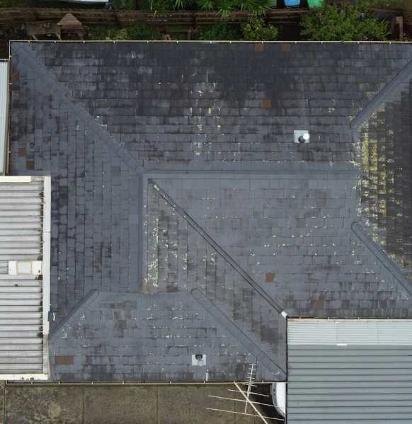 Aerial slate roof in Melbourne needing repair and restoration.