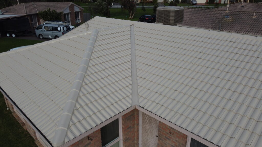 Close-up of tile roof repair in Narre Warren highlighting aligned tiles and freshly sealed ridgelines.