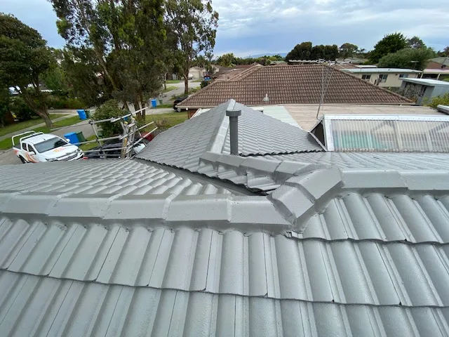 Freshly repaired light grey tiled roof in Rowville with clear ridge lines and visible vent pipe.