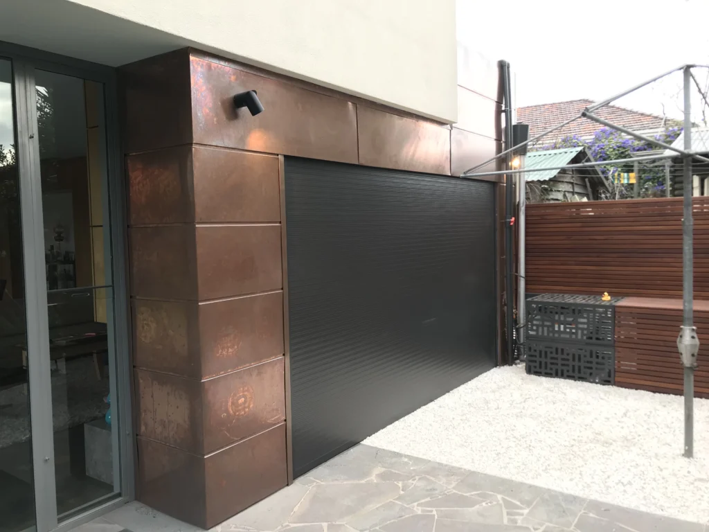 Modern Melbourne garage, sleek door, roofing repair and restoration features.