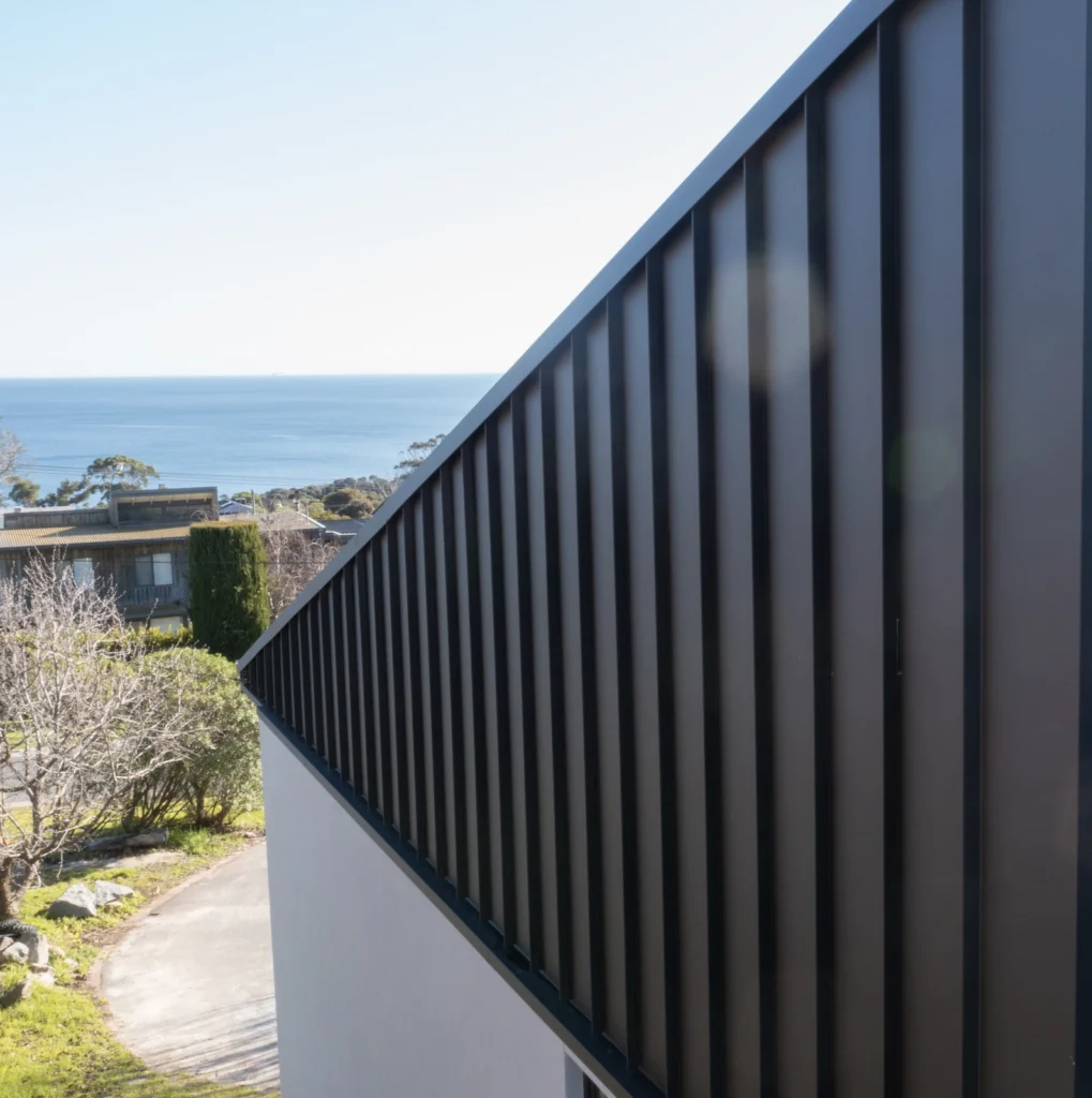 Modern metal-accented building in Melbourne, roofing repair/restoration context.