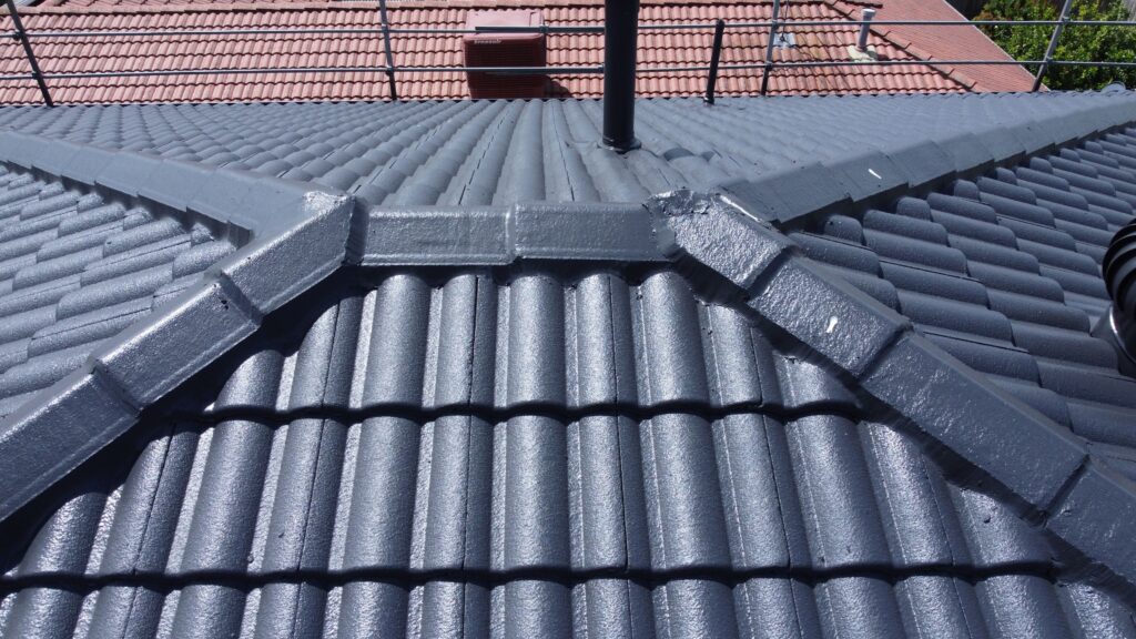 Roof repair and restoration in Melbourne; ridge capping visible.