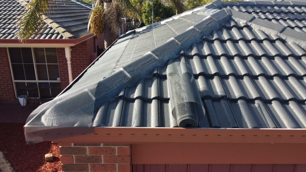 Melbourne tiled roof with gutter guard, mesh roll, restoration repair.