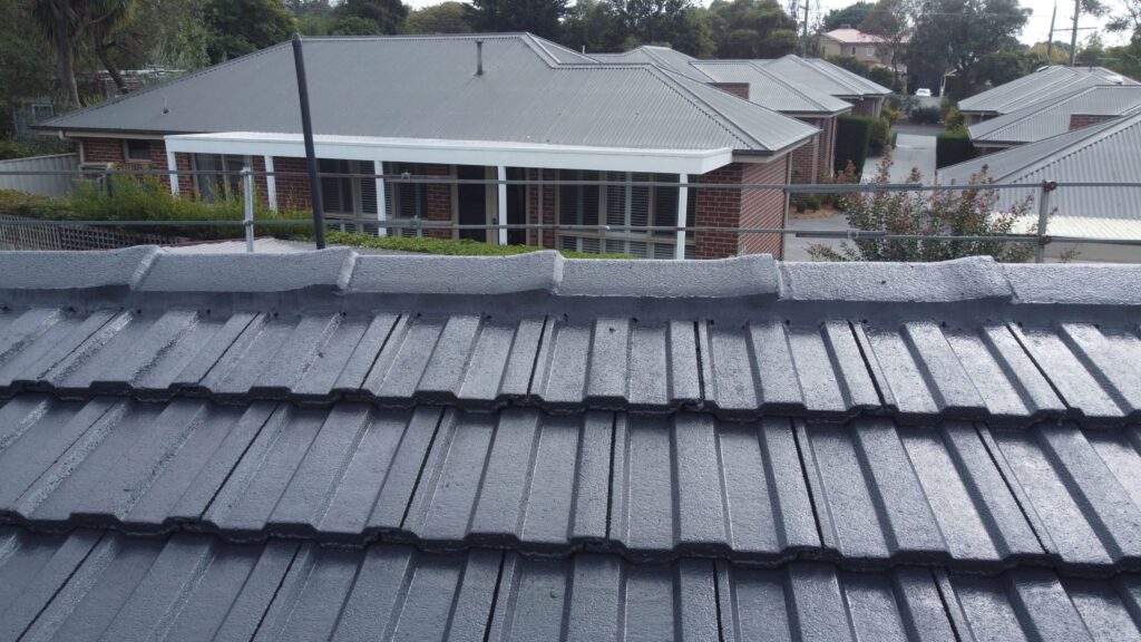 Melbourne rooftop with repaired tiles, ideal for roof restoration.