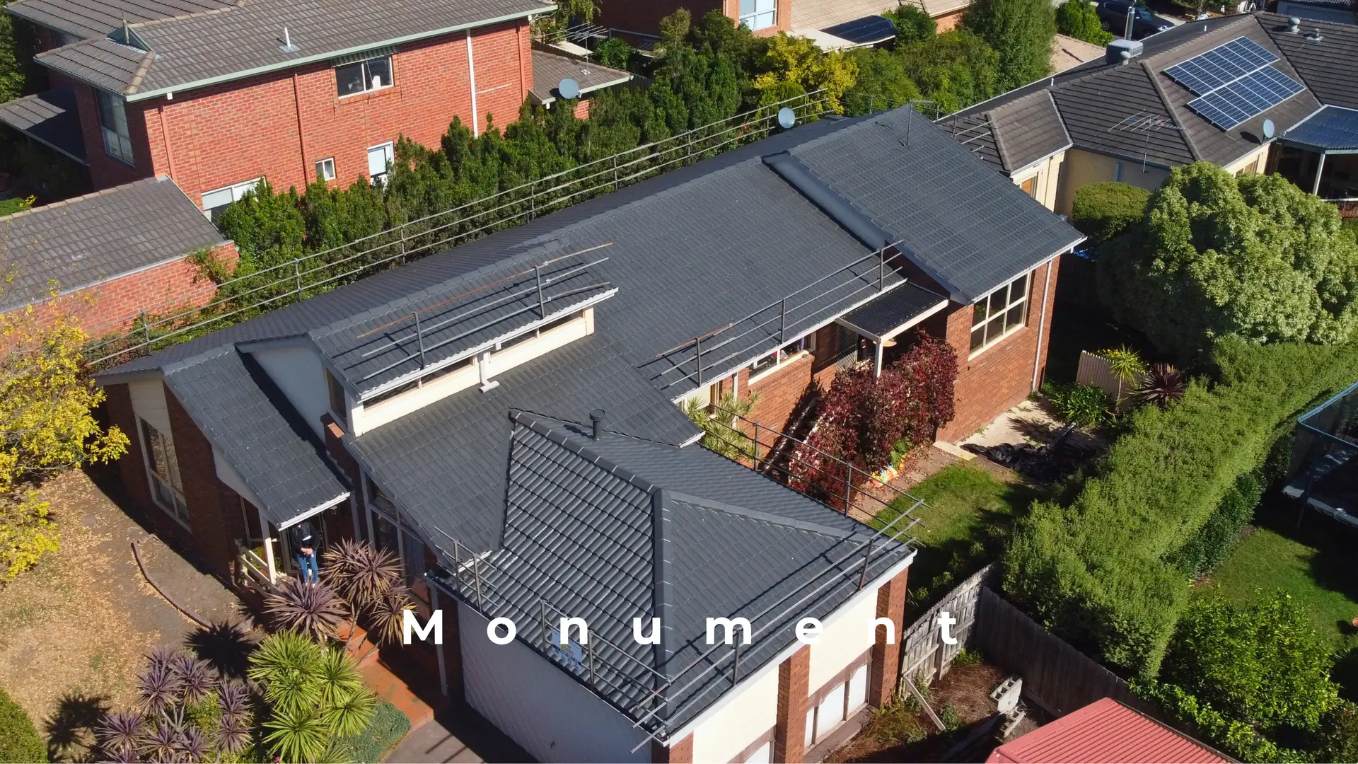 Aerial view: modern Melbourne house, monument roof, repair and restoration theme.