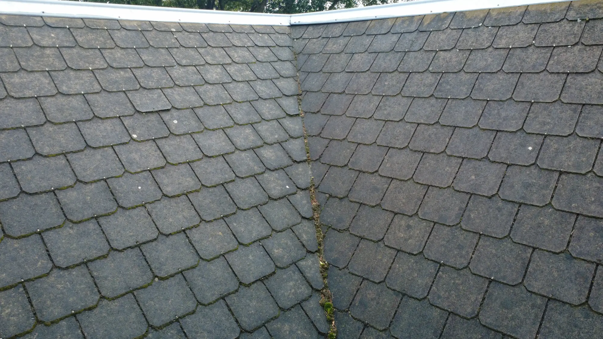 Melbourne roof valley with moss, needs repair and restoration.